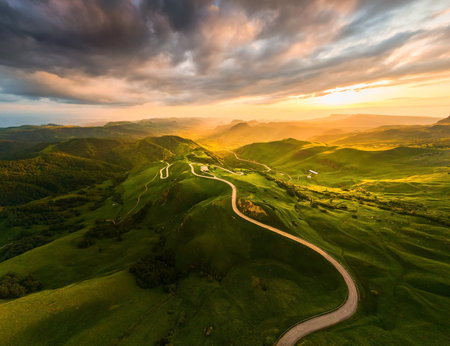 Panoramic view of the green mountains at sunset. Gumbashi Pass in North Caucasus, Russia. Summer landscapeの写真素材