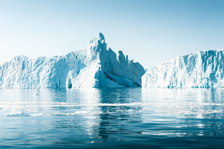 Big blue icebergs in Atlantic ocean, Ilulissat icefjord, western Greenland.の写真素材