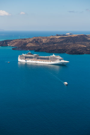 Santorini island, Greece. Cruise ship near the coast. Blue sea and the blue sky. Summer seascape. Travel and vacation conceptの写真素材