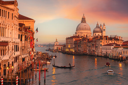 Sunset view of Grand Canal and Basilica Santa Maria della Salute in Venice, Italy. Famous tourist destination.の写真素材