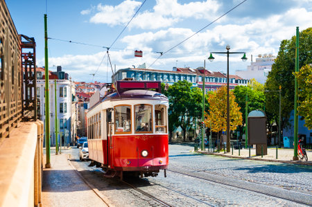 Red vintage tram on the street in Lisbon, Portugal. Summer cityscape. Famous travel destinationの写真素材