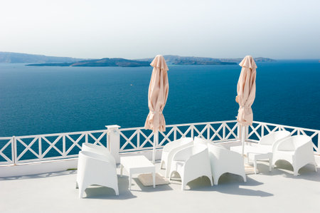 White architecture in Santorini island, Greece. Beautiful terrace with sea view. Travel and vacations conceptの写真素材