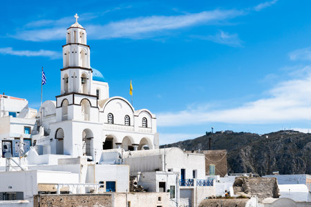 Traditional greek architecture in Pyrgos village, Santorini island, Greece. White cycladic architecture against the blue skyの写真素材