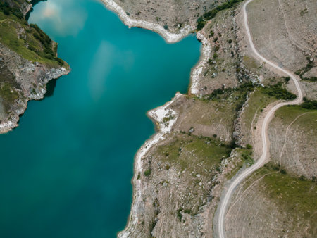 Mountain lake with turquoise water. Gizhgit lake in North Caucasus, Russia. Aerial top down view. Summer landscape.の写真素材