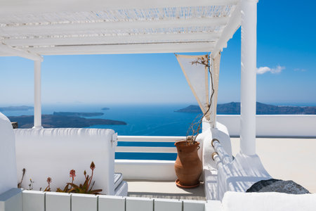 White architecture in Santorini island, Greece. Beautiful terrace with sea view. Travel and vacation conceptの写真素材