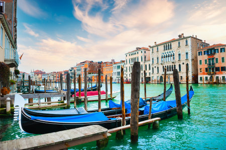 Gondolas on the Grand Canal in Venice, Italy. Beautifil cityscape at sunset. Famous travel destinationの写真素材