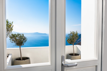 White architecture in Santorini island, Greece. Beautiful terrace with sea view. Travel and summer vacations conceptの写真素材