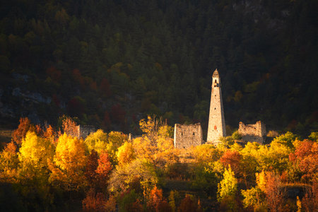 Old stone towers in Erzi national park in Ingushetia, Caucasus, Russia. Beautiful autumn landscape at sunrise.の写真素材