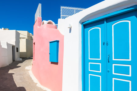 Colorful architecture in Megalochori village, Santorini island, Greece. Beautiful street at sunny dayの写真素材