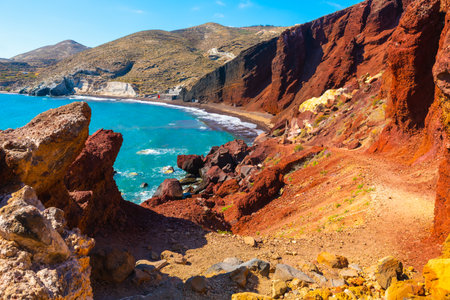 Red beach in Santorini island, Greece. Red volcanic cliffs and the blue sea. Beautiful summer landscape at sunny dayの写真素材