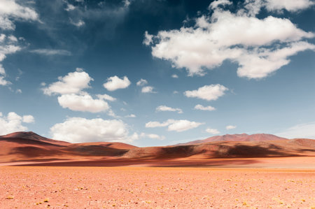 Desert landscape with red hills and the blue sky with clouds, Altiplano plateau, Bolivia. South America landscapesの写真素材