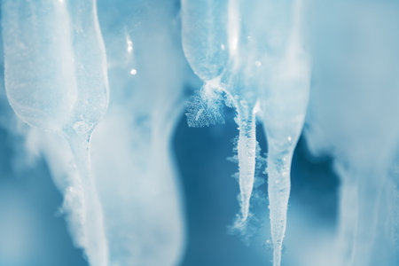 Icicles with hoarfrost in the ice cave. Macro image. Winter nature of Baikal lake, Siberia, Russia. Abstract winter nature backgroundの写真素材