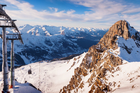 Ski resort in winter Alps mountains, France. View of gondola lift and ski slopes. Meribel, France. Winter landscapeの写真素材