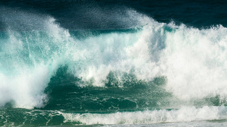 Big ocean waves on the beach at sunset. Atlantic ocean in Nazare, Portugal. Abstract sea waves backgroundの写真素材