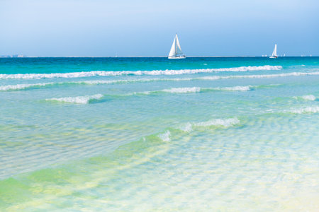 Beautiful beach with white sand and turquoise clear water at warm sunny day. Persian Gulf. in Dubai, United Arab Emirates.の写真素材