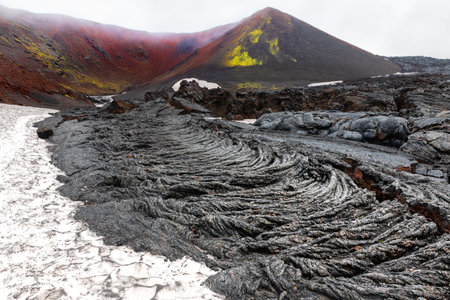 Volcano craters and black lava fields near Tolbachik volcano in Kamchatka, Russia. Kleshnya craters of Tolbachik volcanoの写真素材