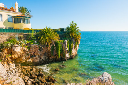 Cascais, Portugal. Beautiful coast of Atlantic ocean with blue water and rocks at sunny day. Famous travel destinationの写真素材