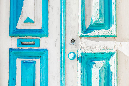 Old wooden door with shabby colorful paint close up. Traditional architecture in Porto, Portugal. Abstract backgroundの写真素材