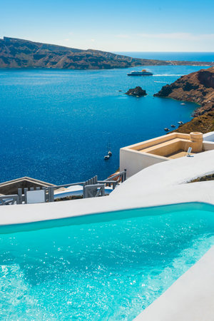 White architecture in Santorini island, Greece. Swimming pool with sea view. Travel and summer vacation conceptの写真素材