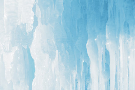Blue transparent icicles in the ice cave. Macro image. Winter nature of Baikal lake, Siberia, Russia. Abstract winter nature backgroundの写真素材
