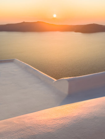 Beautiful sunset at Santorini island, Greece. White architecture with sea view. Travel and summer vacationの写真素材