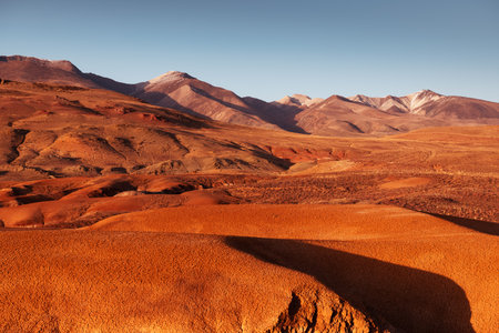 Red colorful mountains in Kyzyl-Chin valley in Altai, Siberia, Russia. Autumn landscape at sunset