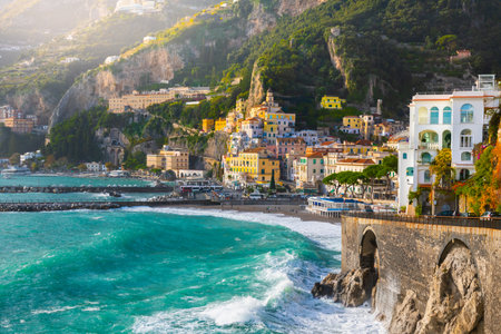 Amalfi coast at sunset, Italy. Beautiful view of Amalfi town with colorful architecture on the rocks. Famous travel destination.の写真素材