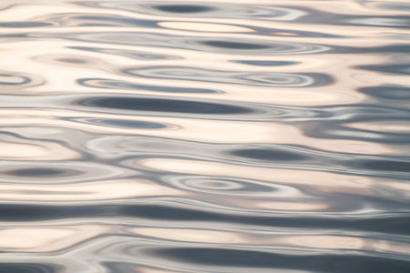 Light ripples on the water surface. Abstract nature background. Texture of waterの写真素材