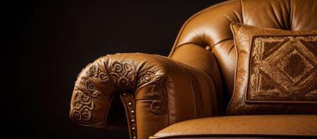 Close-up of a luxurious brown leather armchair. The chair showcases intricate embroidery and...