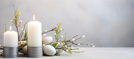 A peaceful Easter scene with white candles, painted eggs, and delicate spring branches.