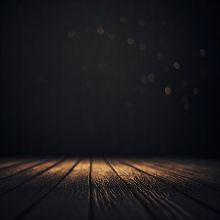 A dark wooden floor with glowing particles in the background. Perfect for product display or moody design.の写真素材