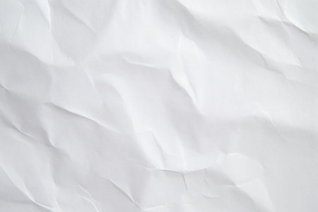 Close-up of a crumpled white paper texture. Great for backgrounds.の写真素材