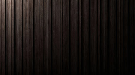 Abstract dark brown wooden texture. Vertical lines and shades create a rich background.の写真素材