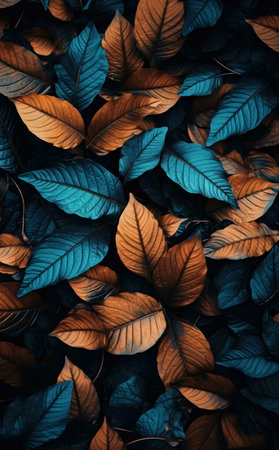 Close-up view of teal and copper leaves forming a beautiful autumnal pattern.