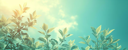 Soft sunlight filters through vibrant green leaves against a tranquil blue sky. A peaceful...