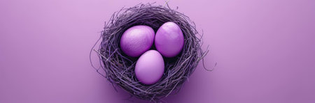 Three pastel purple Easter eggs nestled together in a bird's nest. A serene spring image.の写真素材