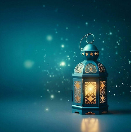 A beautifully crafted lantern with intricate designs, casting a warm, glowing light on a dark blue background.の写真素材
