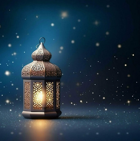 A beautifully detailed Ramadan lantern glows in the darkness, casting a warm light against a...
