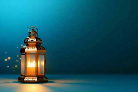 A golden lantern with a lit candle, a symbol of light and hope, against a blue background.の写真素材