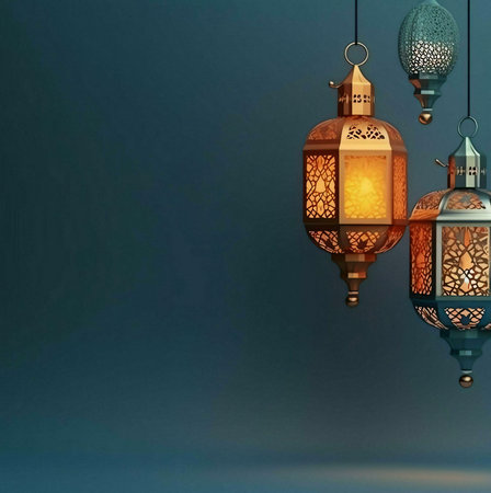 Three ornate lanterns hang against a dark blue background, casting a warm glow.の写真素材
