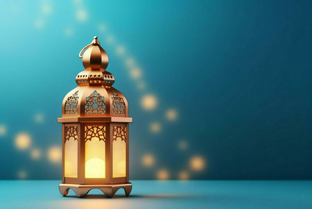 A golden lantern with intricate designs stands on a blue surface, emitting a warm glow against a...