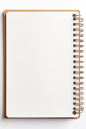A blank spiral notebook with a white cover and a brown border on a white backgroundの写真素材