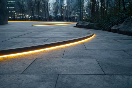 A curving pathway illuminated by warm, ambient light. The scene exudes serenity and calmness.の写真素材