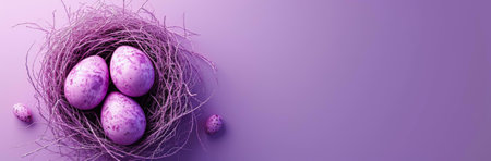 Three speckled lavender eggs sit in a delicate purple nest. Two smaller eggs rest nearby on a...