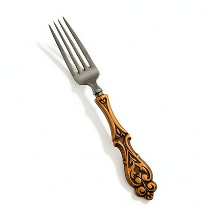 Close-up of an elegant fork with a bronze and silver design.の写真素材