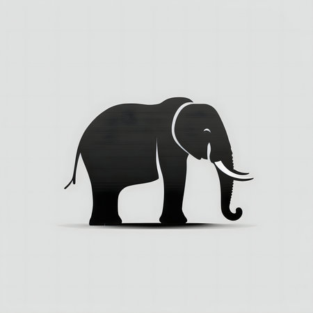 A striking black silhouette of an elephant against a light gray background. A powerful image.の写真素材