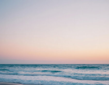 Peaceful ocean sunset with soft pastel colors.の写真素材