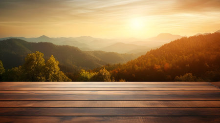 Serene sunset over mountains. Golden hour light bathes hills. Wooden deck adds warmth.の写真素材