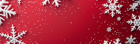 Festive Christmas background with white snowflakes on a red backdropの写真素材