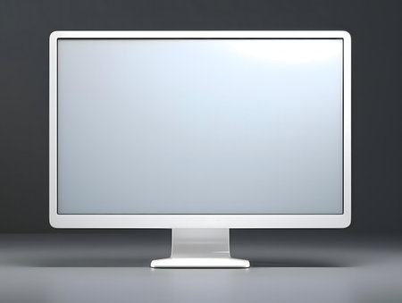 A modern white computer monitor on a gray background. Clean and simple design.の写真素材